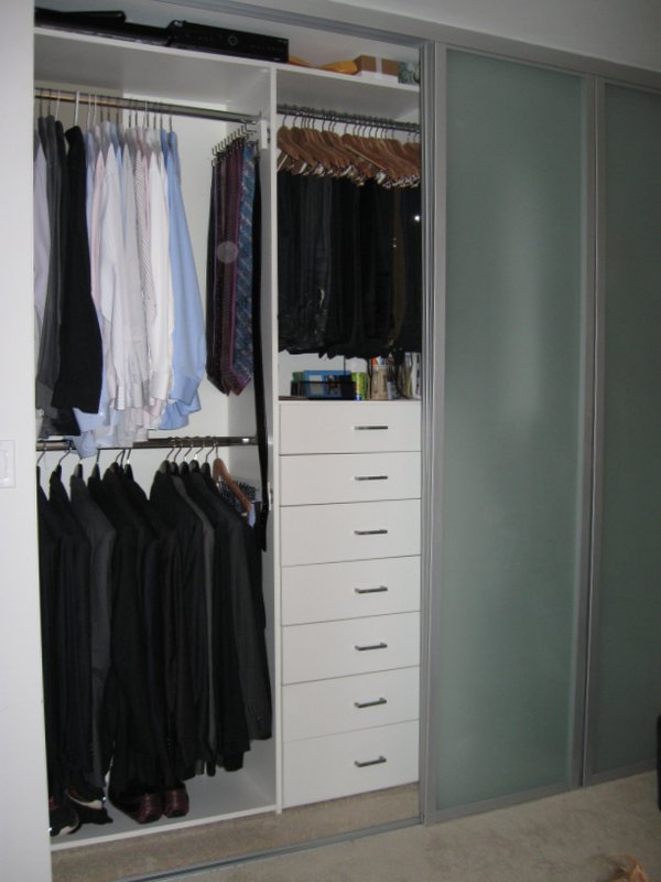 Mens, white melamine reach in closet  with drawers, folded clothes shelves and shoe Shelves 