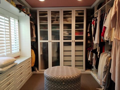 white closet and sitting space